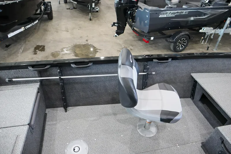 Slide: The Image of 2025 Crestliner 1750 Hawk SC boat interior with swivel seat and storage compartments. - 9