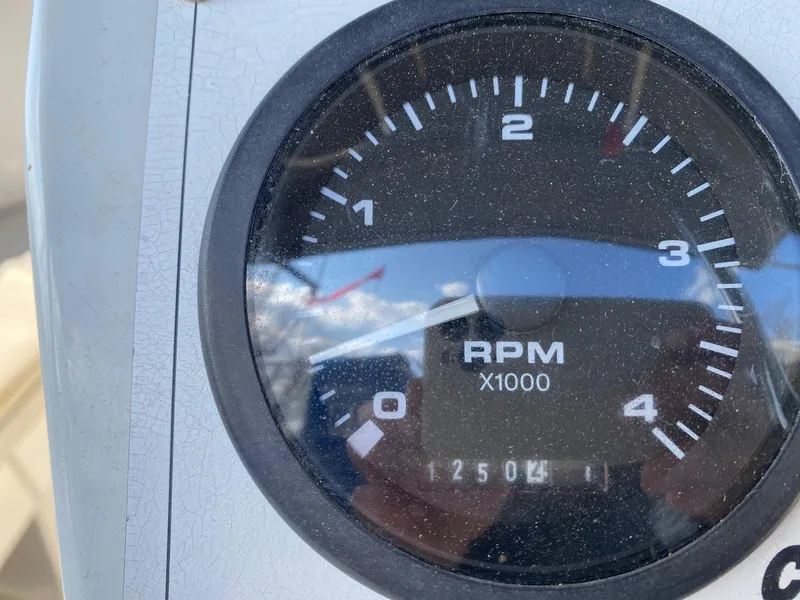 Slide: The Image of Close-up of a Catalina 350 tachometer showing 1250 RPM. - 18