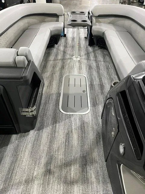 Slide: The Image of 2025 Bennington M 26 Swingback interior with gray seating and modern design. - 12
