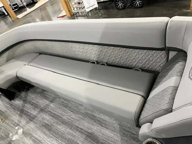 Slide: The Image of 2025 Bennington M 26 Swingback interior with luxurious gray seating and quilted design. - 13
