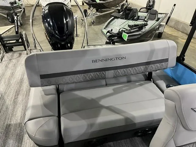 Slide: The Image of 2025 Bennington M 26 Swingback boat interior with gray seating and modern design. - 14