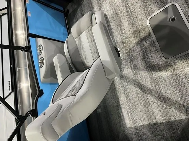 Slide: The Image of 2025 Bennington M 26 Swingback boat interior with plush seating and modern design. - 15