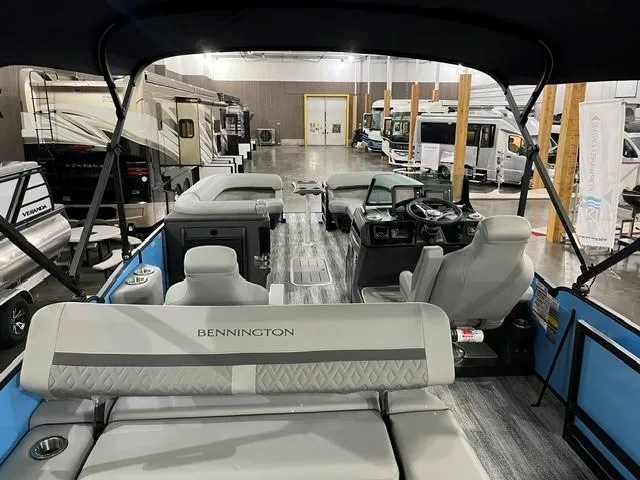 Slide: The Image of 2025 Bennington M 26 Swingback pontoon boat interior at a showroom. - 9