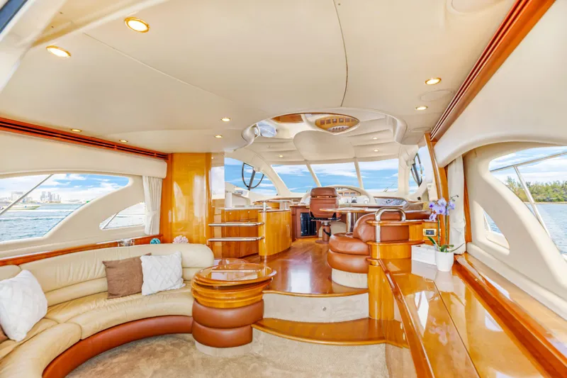 Slide: The Image of Luxurious interior of a 2005 Azimut 55E yacht with elegant seating and panoramic windows. - 15