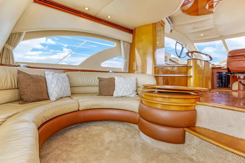 Slide: The Image of Luxurious interior of a 2005 Azimut 55E yacht with elegant seating and wooden accents. - 16