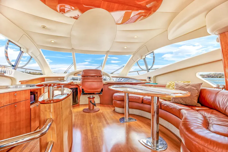 Slide: The Image of Luxurious interior of a 2005 Azimut 55E yacht with leather seating and panoramic windows. - 17