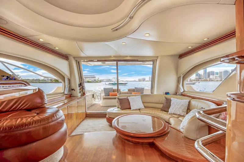 Slide: The Image of Luxurious interior of a 2005 Azimut 55E yacht with elegant seating and scenic water views. - 19