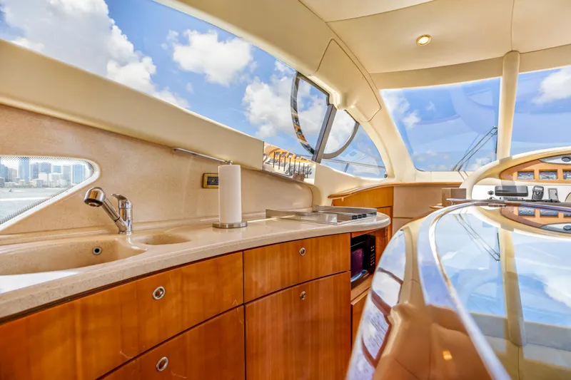 Slide: The Image of Luxurious interior of 2005 Azimut 55E yacht with modern kitchen amenities. - 22