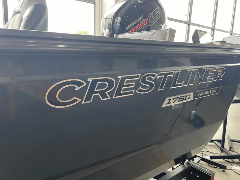 Slide: The Image of 2025 Crestliner 1750 Hawk SC boat with Mercury Pro XS engine in showroom. - 10