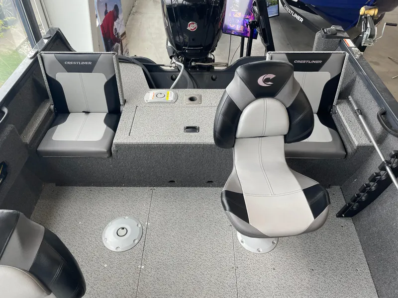 Slide: The Image of Interior of 2025 Crestliner 1750 Hawk SC boat with seating and motor. - 2