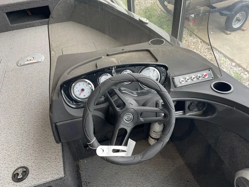 Slide: The Image of Steering console of 2025 Crestliner 1750 Hawk SC boat with gauges and controls. - 7