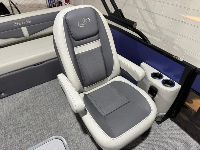 Slide: The Image of 2025 Barletta Cabrio 22UC boat seat with armrests and cup holders. - 25