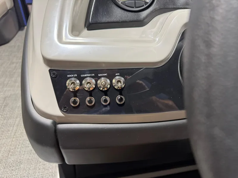 Slide: The Image of Control panel of 2025 Barletta Cabrio 22UC boat with labeled switches. - 29