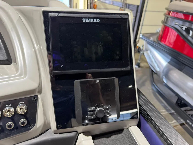 Slide: The Image of Control panel of 2025 Barletta Cabrio 22UC with Simrad and JBL systems. - 31