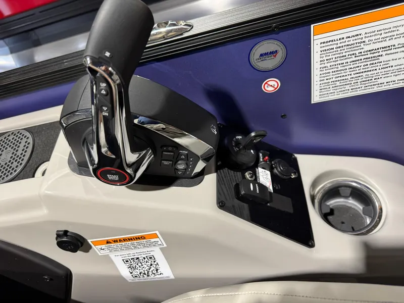 Slide: The Image of Control panel of 2025 Barletta Cabrio 22UC boat with throttle and warning labels. - 32