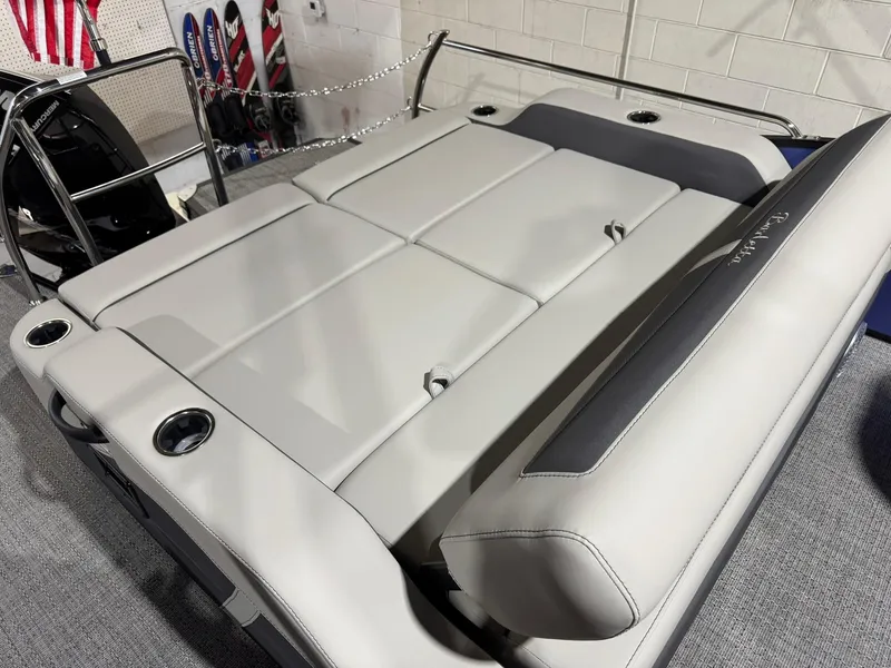 Slide: The Image of 2025 Barletta Cabrio 22UC boat interior with plush seating and cup holders. - 36
