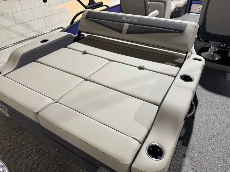 Slide: The Image of 2025 Barletta Cabrio 22UC boat interior with luxurious seating and cup holders. - 37