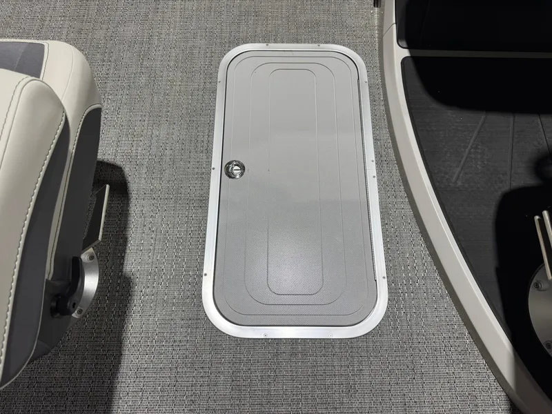 Slide: The Image of 2025 Barletta Cabrio 22UC boat floor with storage hatch and seating. - 39