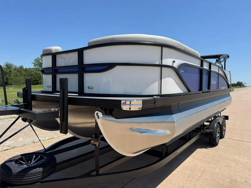 Slide: The Image of 2025 Barletta Cabrio 22UC pontoon boat on trailer, sunny day, side view. - 5