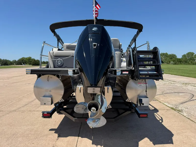 Slide: The Image of 2025 Barletta Cabrio 22UC pontoon boat rear view with outboard motor and ladder. - 9