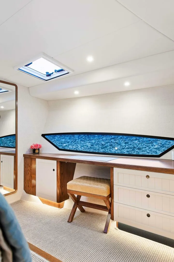 Slide: The Image of Interior of 2021 Valder Yachts Powercat, featuring elegant wood accents and ocean view. - 16