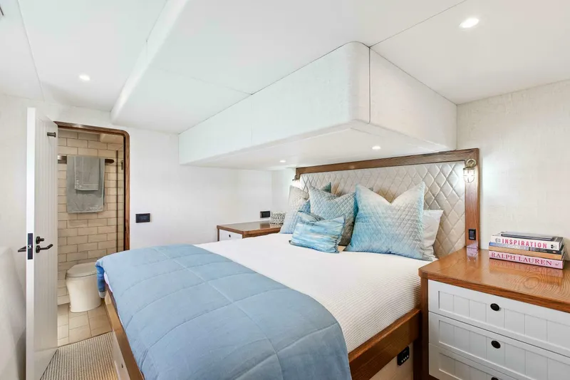 Slide: The Image of Luxurious bedroom on 2021 Valder Yachts Powercat with elegant decor and ensuite bathroom. - 18