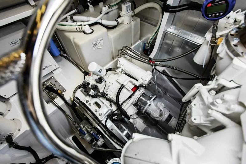 Slide: The Image of Engine room of 2021 Custom Valder Yachts Powercat, showcasing mechanical components and wiring. - 26