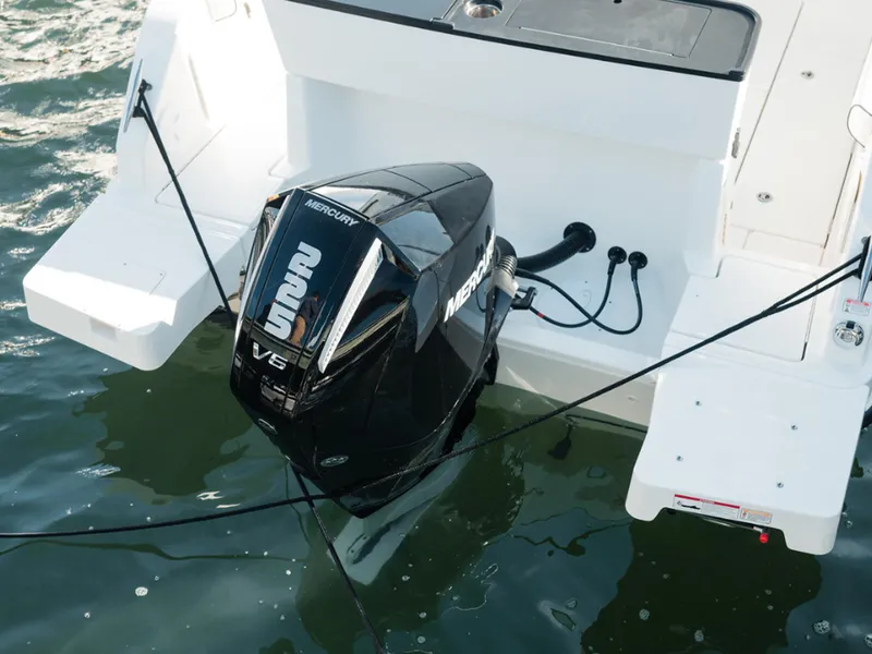 Slide: The Image of 2024 Bayliner Trophy T25PH with Mercury V6 outboard engine on water. - 14