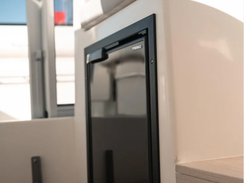 Slide: The Image of 2024 Bayliner Trophy T25PH interior with compact fridge. - 20