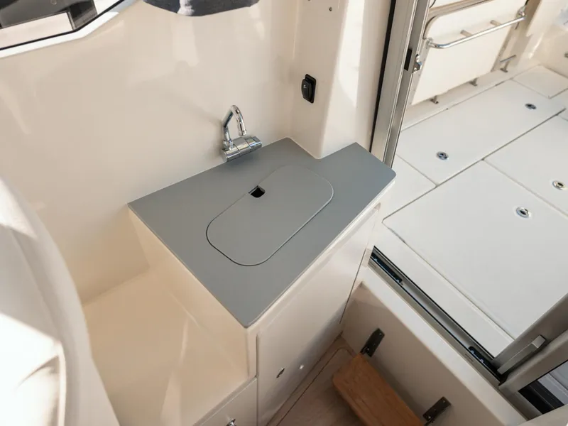 Slide: The Image of 2024 Bayliner Trophy T25PH interior sink and counter area. - 21