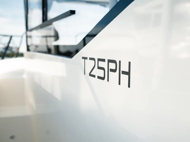 Slide: The Image of 2024 Bayliner Trophy T25PH boat exterior with model name visible. - 24