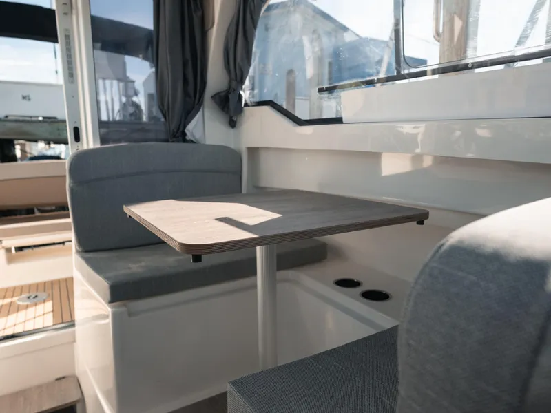 Slide: The Image of 2024 Bayliner Trophy T25PH interior with seating and table, featuring modern design and comfort. - 28