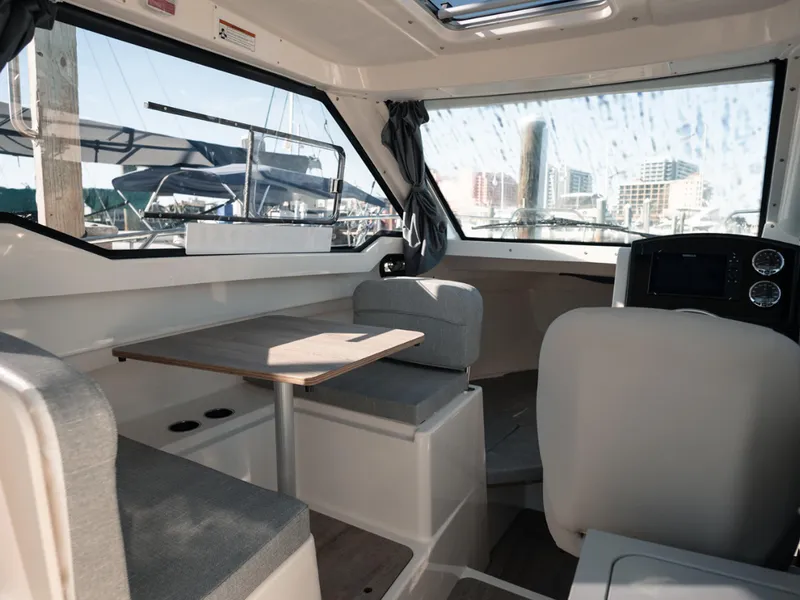 Slide: The Image of Interior of 2024 Bayliner Trophy T25PH boat with seating and table. - 29
