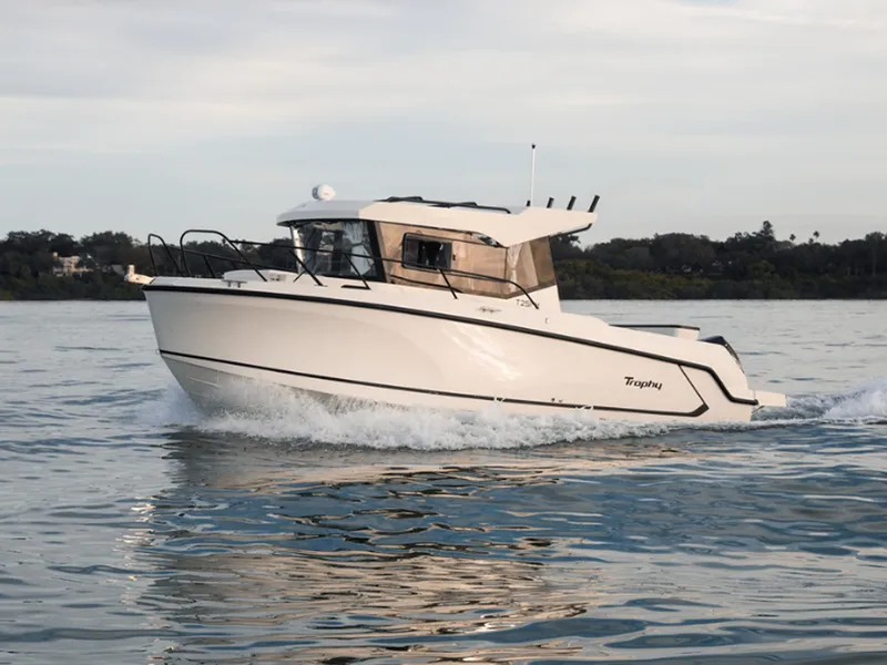 Slide: The Image of 2024 Bayliner Trophy T25PH boat cruising on calm water. - 3