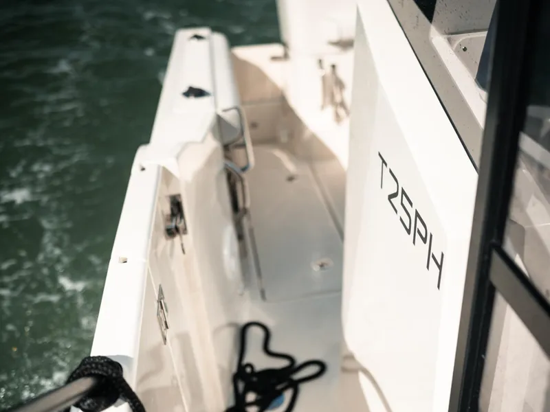 Slide: The Image of 2024 Bayliner Trophy T25PH boat deck with water view. - 36