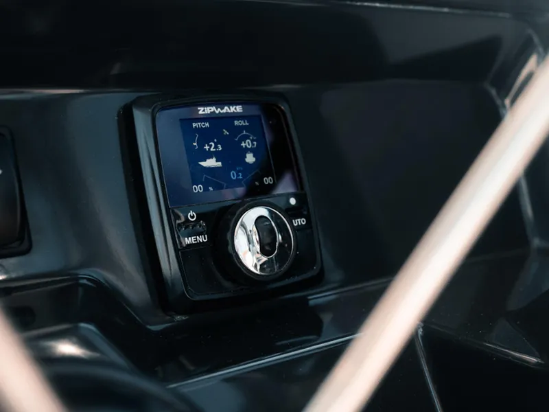 Slide: The Image of Control panel of 2024 Bayliner Trophy T25PH boat, featuring Zipwake pitch and roll display. - 9