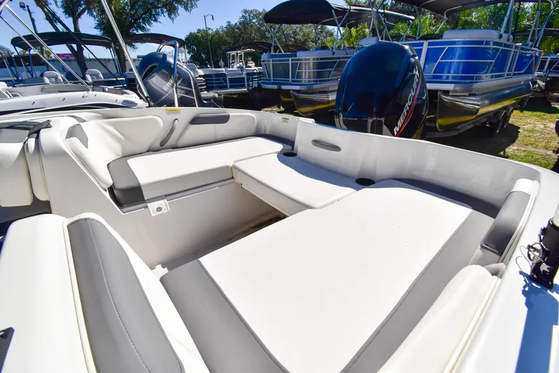 Slide: The Image of 2025 Bayliner E18 boat interior with spacious seating and modern design. - 7