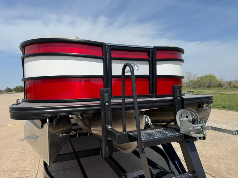 Slide: The Image of 2025 Barletta Lusso 23UC pontoon boat with red and white exterior on a trailer. - 14