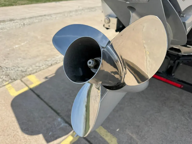 Slide: The Image of 2025 Barletta Lusso 23UC boat propeller, shiny and metallic, on a concrete surface. - 17