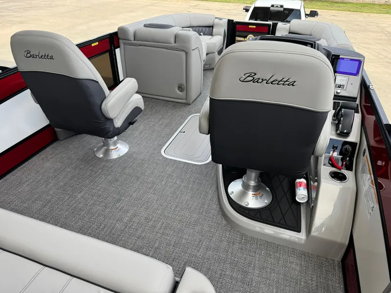 Slide: The Image of 2025 Barletta Lusso 23UC interior with plush seating and modern dashboard. - 21
