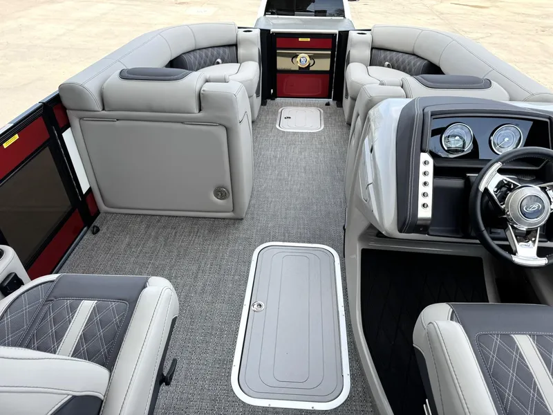 Slide: The Image of 2025 Barletta Lusso 23UC boat interior with luxurious seating and modern dashboard design. - 22