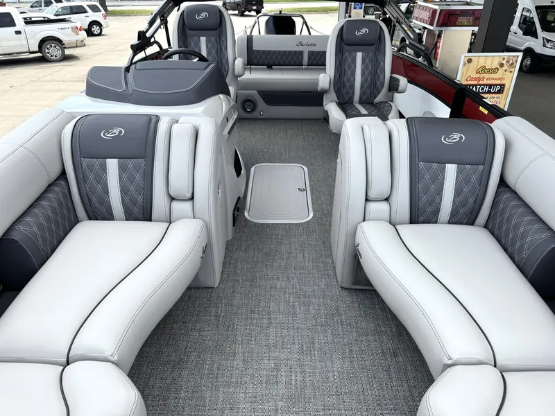 Slide: The Image of 2025 Barletta Lusso 23UC pontoon boat interior with luxurious seating and modern design. - 28