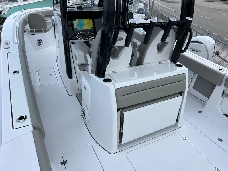 Slide: The Image of 2025 Sportsman Open 322 Center Console boat interior with seating and console features. - 11
