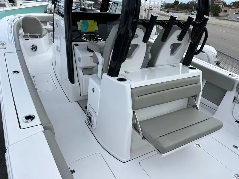 Slide: The Image of 2025 Sportsman Open 322 Center Console boat interior with seating and helm station. - 13