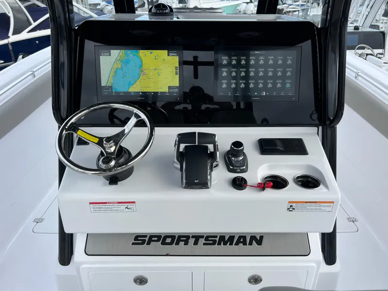 Slide: The Image of 2025 Sportsman Open 322 Center Console dashboard with navigation and control systems. - 15