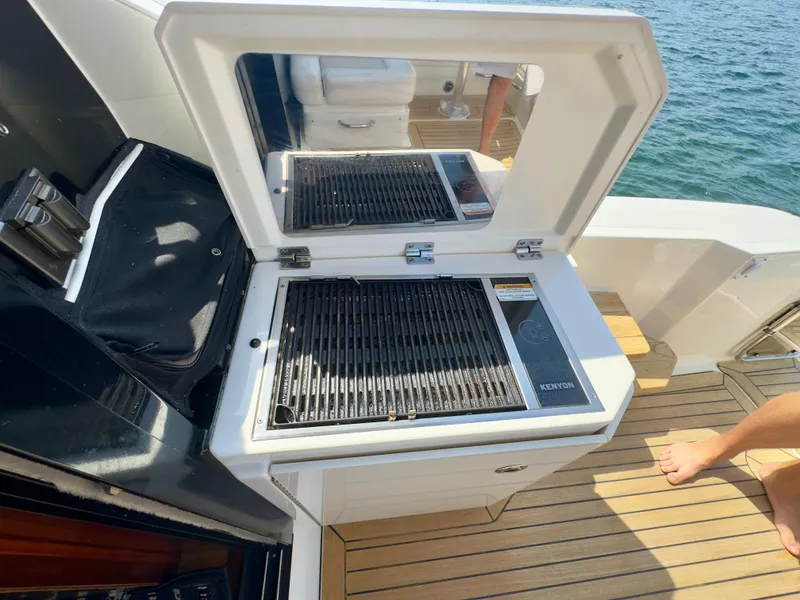 Slide: The Image of Outdoor grill on 2014 Sea Ray 510 Sundancer yacht deck, overlooking water. - 15