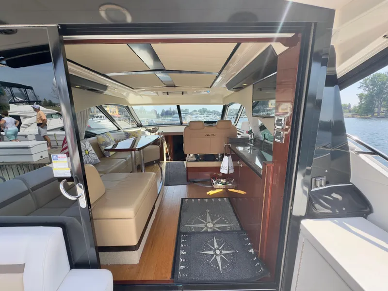 Slide: The Image of Interior view of 2014 Sea Ray 510 Sundancer yacht, featuring luxurious seating and modern design. - 16