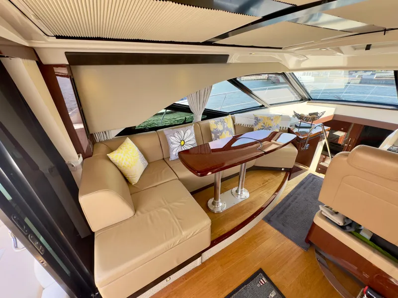 Slide: The Image of Luxurious interior of 2014 Sea Ray 510 Sundancer yacht with elegant seating and wooden table. - 17