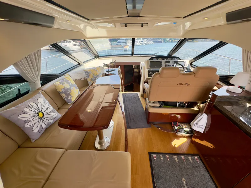 Slide: The Image of Luxurious interior of a 2014 Sea Ray 510 Sundancer yacht with elegant seating and helm. - 18