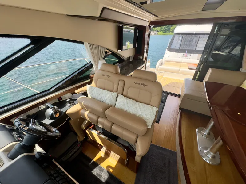 Slide: The Image of Luxurious interior of 2014 Sea Ray 510 Sundancer yacht with leather seating and scenic water view. - 23